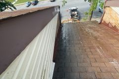 Heavy staining made the apartment roof look aged and worn before our service.
