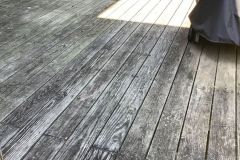 Pressure washing transformation of a backyard deck