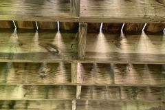 Before and after of a wood deck cleaning in Maryland