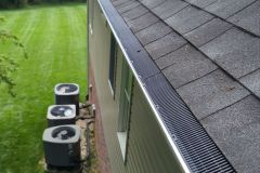 Close-up of gutter guards installed to improve gutter protection and keep this home’s drainage system working year-round.